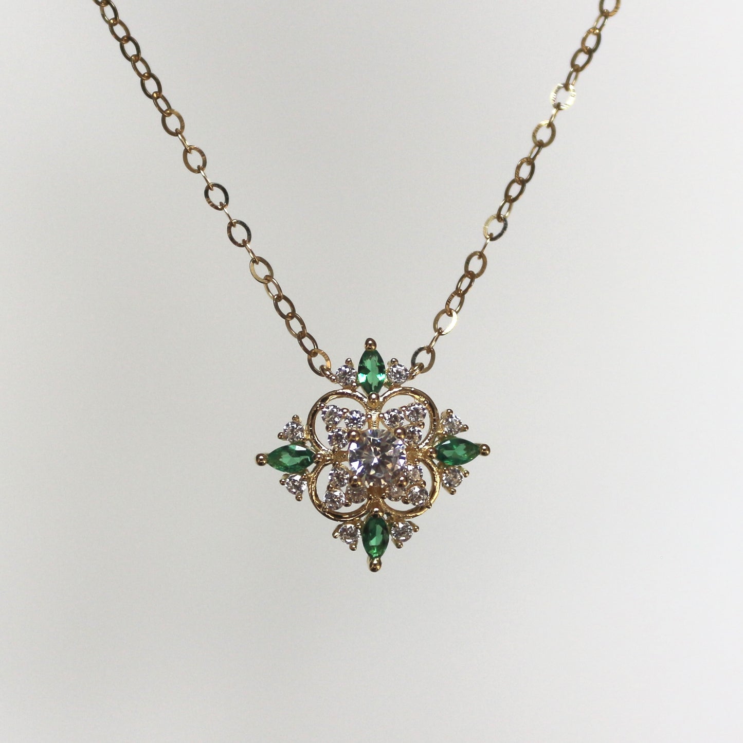 Floral Necklace with Zircon and Emerald Accents